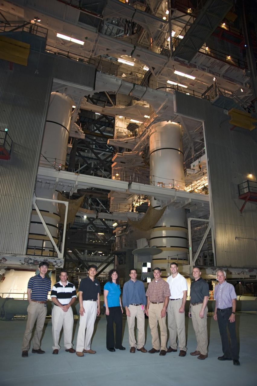 CAPE CANAVERAL, Fla. --- At NASA's Kennedy Space Center in Florida, members of the Class of 2009 Astronaut Candidates, also called ASCANs, take a picture in a high bay of the Vehicle Assembly Building. From left, are JAXA's Kimiya Yui, NASA's Navy Cmdr. Scott D. Tingle, JAXA's Takuya Onishi, NASA's Serena M. Aunon, NASA Test Director Michael Ciannilli, NASA's Air Force Lt. Col. Michael S. Hopkins, CSA's Jeremy Hansen, NASA's Air Force Maj. Jack D. Fischer, and Chief of the Astronaut Candidate Program Duane Ross.