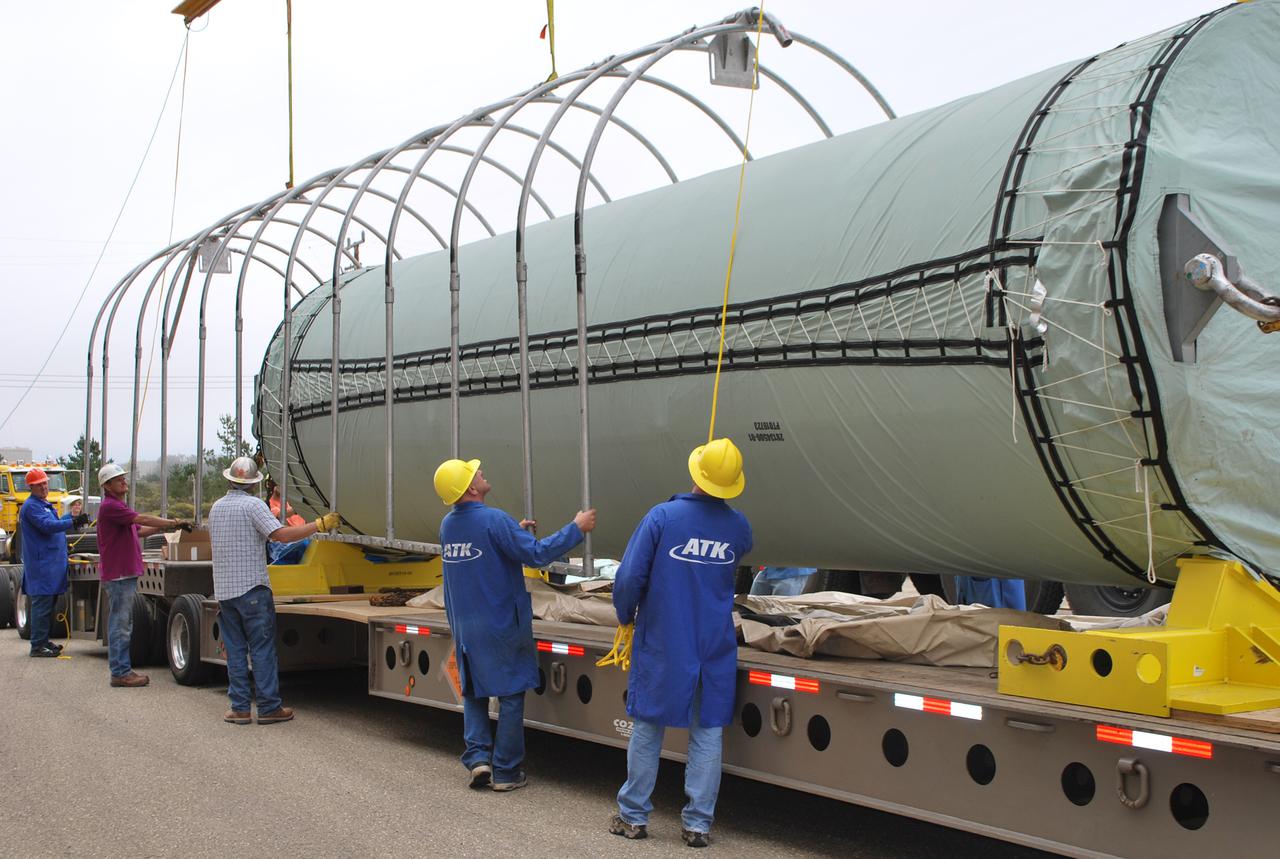 VANDENBERG AIR FORCE BASE, Calif. -- At Vandenberg Air Force Base in California, the Stage 0 motor for the Taurus XL launch vehicle is revealed. The motor will help carry NASA's Glory satellite into low Earth orbit. Glory is scheduled to launch in November from Vandenberg's Launch Pad SLC 576-E. Once Glory reaches orbit, it will collect data on the properties of aerosols and black carbon. It also will help scientists understand how the sun's irradiance affects Earth's climate. Photo credit: NASA_Randy Beaudoin, VAFB