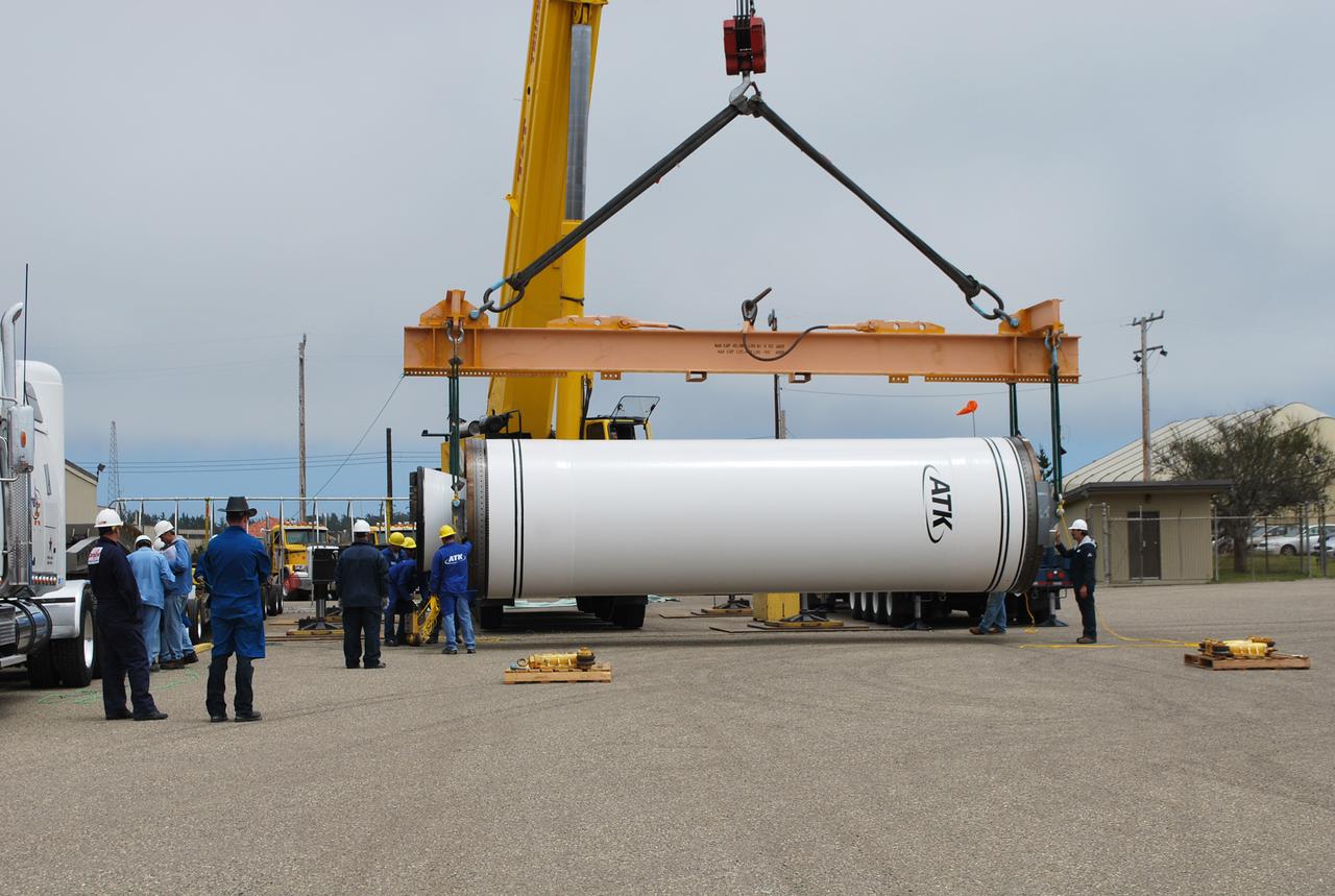 VANDENBERG AIR FORCE BASE, Calif. -- At Vandenberg Air Force Base in California, a crane lowers the Stage 0 motor for the Taurus XL launch vehicle to the ground for its move into Orbital Sciences' Hangar 1555. The motor will help carry NASA's Glory satellite into low Earth orbit.   Glory is scheduled to launch in November from Vandenberg's Launch Pad SLC 576-E. Once Glory reaches orbit, it will collect data on the properties of aerosols and black carbon. It also will help scientists understand how the sun's irradiance affects Earth's climate.  Photo credit: NASA_Randy Beaudoin, VAFB