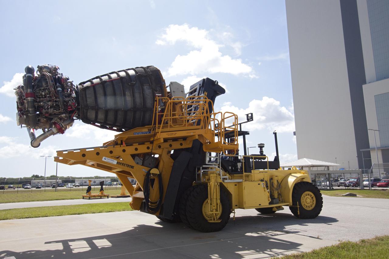 CAPE CANAVERAL, Fla. -- At NASA's Kennedy Space Center in Florida, a space shuttle main engine secured on a Hyster forklift moves from the Space Shuttle Main Engine Processing Facility to Orbiter Processing Facility-3. Three main engines, weighing 7,000 pounds each, will be installed in space shuttle Discovery for the STS-133 mission to the International Space Station. Discovery and its STS-133 crew are targeted to deliver the Express Logistics Carrier-4 filled with external payloads and experiments, as well as critical spare components to the station later this year. Photo credit: NASA_Jack Pfaller
