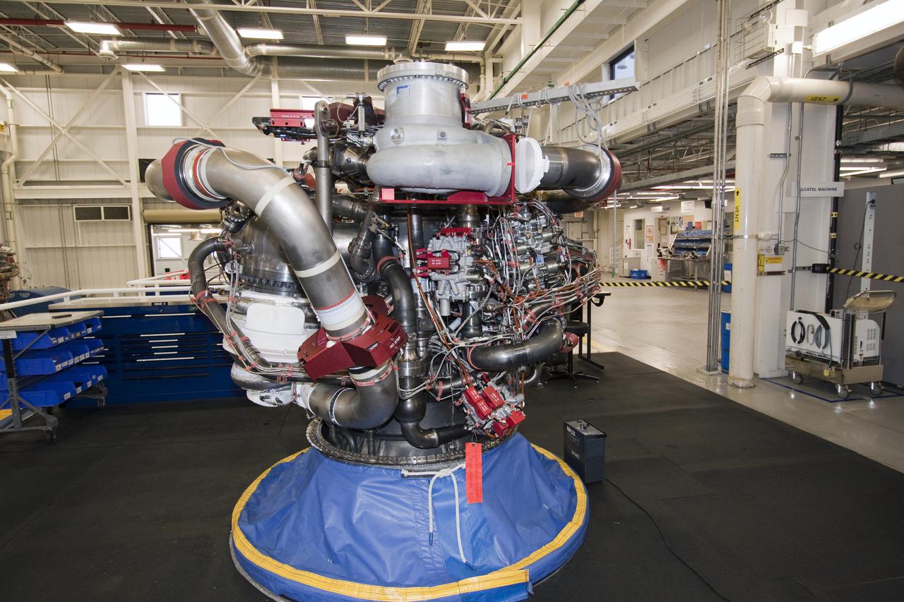 CAPE CANAVERAL, Fla. -- In the Space Shuttle Main Engine Processing Facility at NASA's Kennedy Space Center in Florida, space shuttle main engine No. 1 is outfitted with a new turbopump. A suspect turbopump experienced an issue during torque testing and had to be removed and replaced for Discovery's STS-133 mission to the International Space Station. Next, all three main engines will be transported back to Orbiter Processing Facility-3 and reinstalled.  The shuttle and its STS-133 crew are targeted to deliver the Express Logistics Carrier-4 filled with external payloads and experiments, as well as critical spare components to the station later this year. Photo credit: NASA_Jack Pfaller