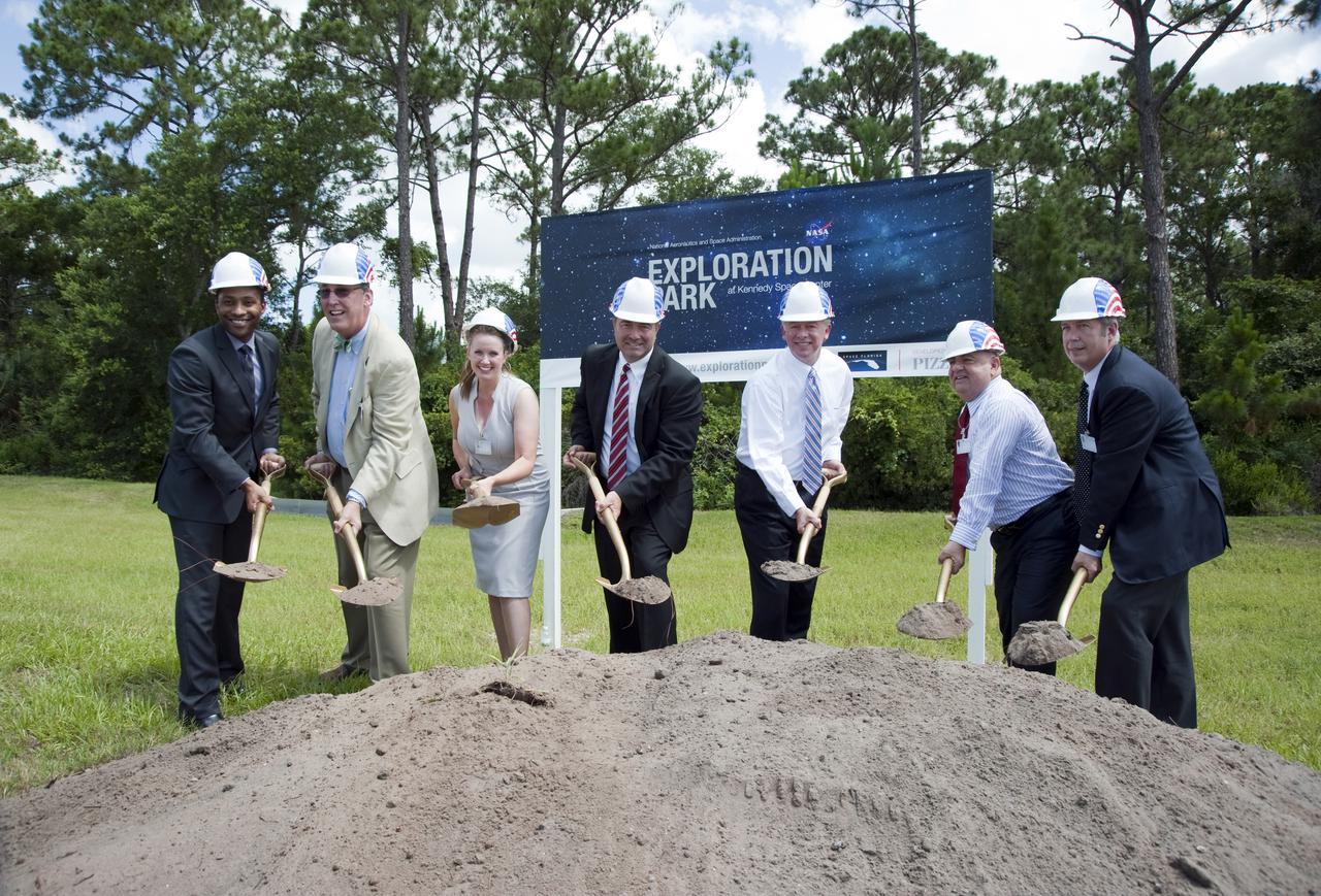 CAPE CANAVERAL, Fla. – At NASA's Kennedy Space Center in Florida, The Pizzuti Companies Naeem Coleman, left, Mike Bird, Stephanie Moreton and Tom Harmer, Florida Lt. Gov. Jeff Kottkamp, and The Pizzuti Companies Ron Pizzuti and Jim Russell break ground on Exploration Park outside of the Space Life Sciences Laboratory, or SLSL.  Exploration Park is designed to be a strategically located complex, adjacent to the SLSL, for servicing diverse tenants and uses that will engage in activities to support space-related activities of NASA, other government agencies and the U.S. commercial space industry, as well as bring new aerospace work to the Space Coast. The SLSL will be the anchor facility for the park, which is expected to open its first new facility in early 2012. Photo Credit: NASA_Kim Shiflett