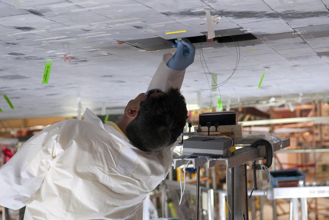 STS-133 DISCOVERY BOUNDARY LAYER TRANSITION TILE BONDING