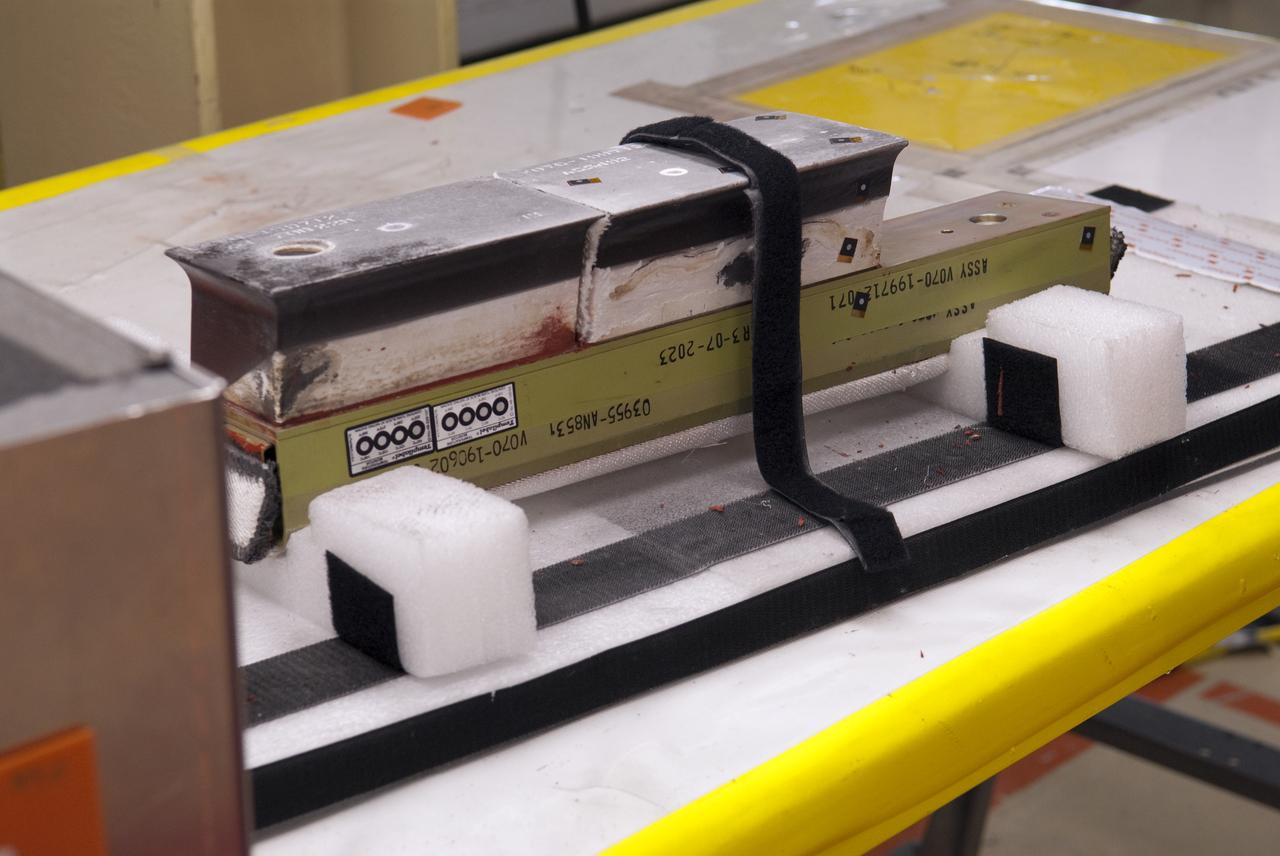 STS-133 DISCOVERY BOUNDARY LAYER TRANSITION TILE BONDING