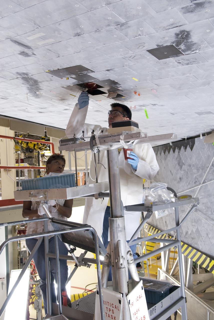 STS-133 DISCOVERY BOUNDARY LAYER TRANSITION TILE BONDING