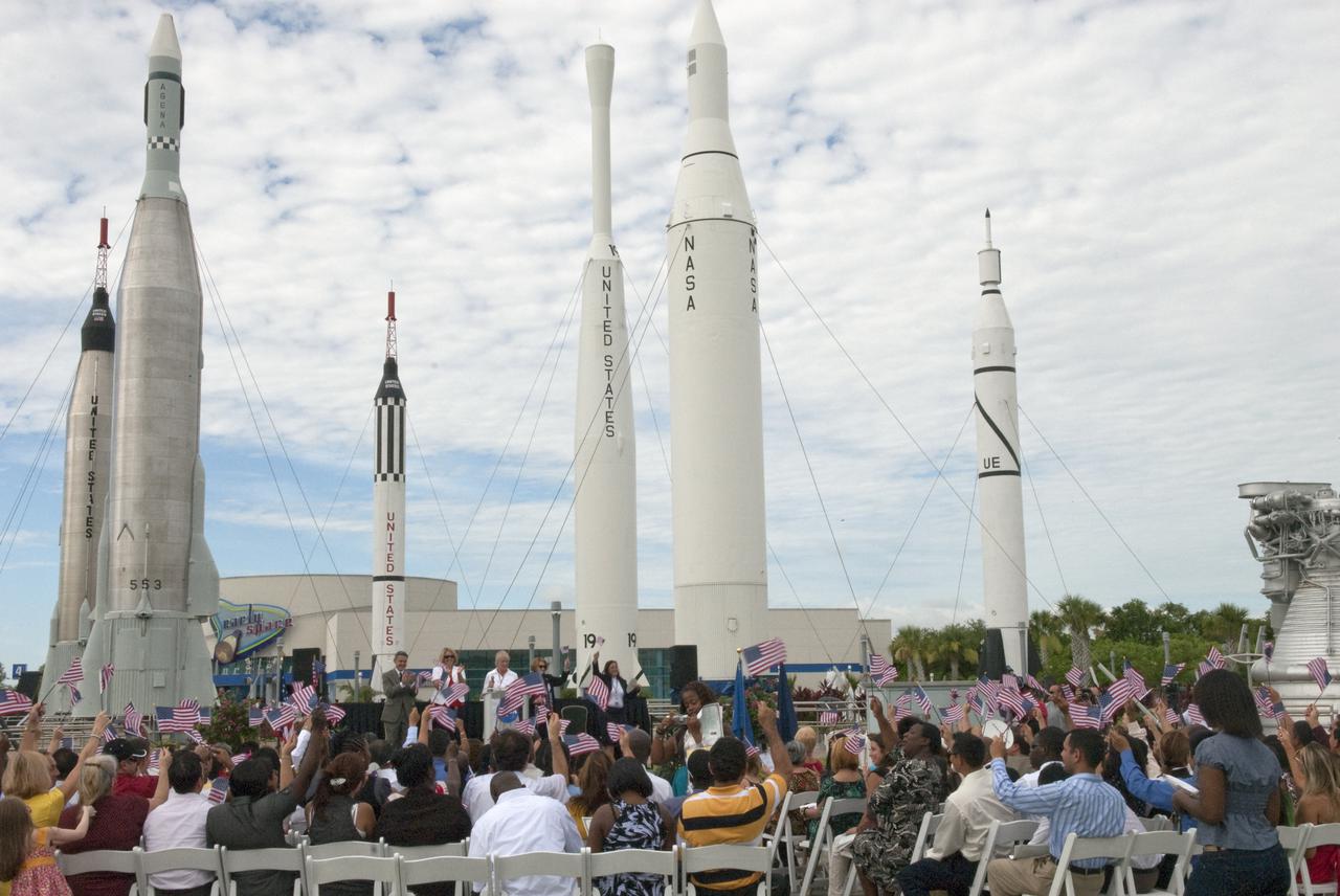 CAPE CANAVERAL, Fla. – At the Kennedy Space Center Visitor Complex in Florida, 110 people, representing 36 countries, celebrate becoming American citizens during a naturalization ceremony. U.S. Citizenship and Immigration Services administered the oath in the complex's Rocket Garden in honor of the upcoming Independence Day holiday.    This was the first naturalization ceremony hosted by a NASA facility. An estimated 3,800 candidates will become citizens at 55 special ceremonies, including the one at Kennedy, held across the country and around the world July 1-6. Photo Credit: NASA_Jim Grossmann