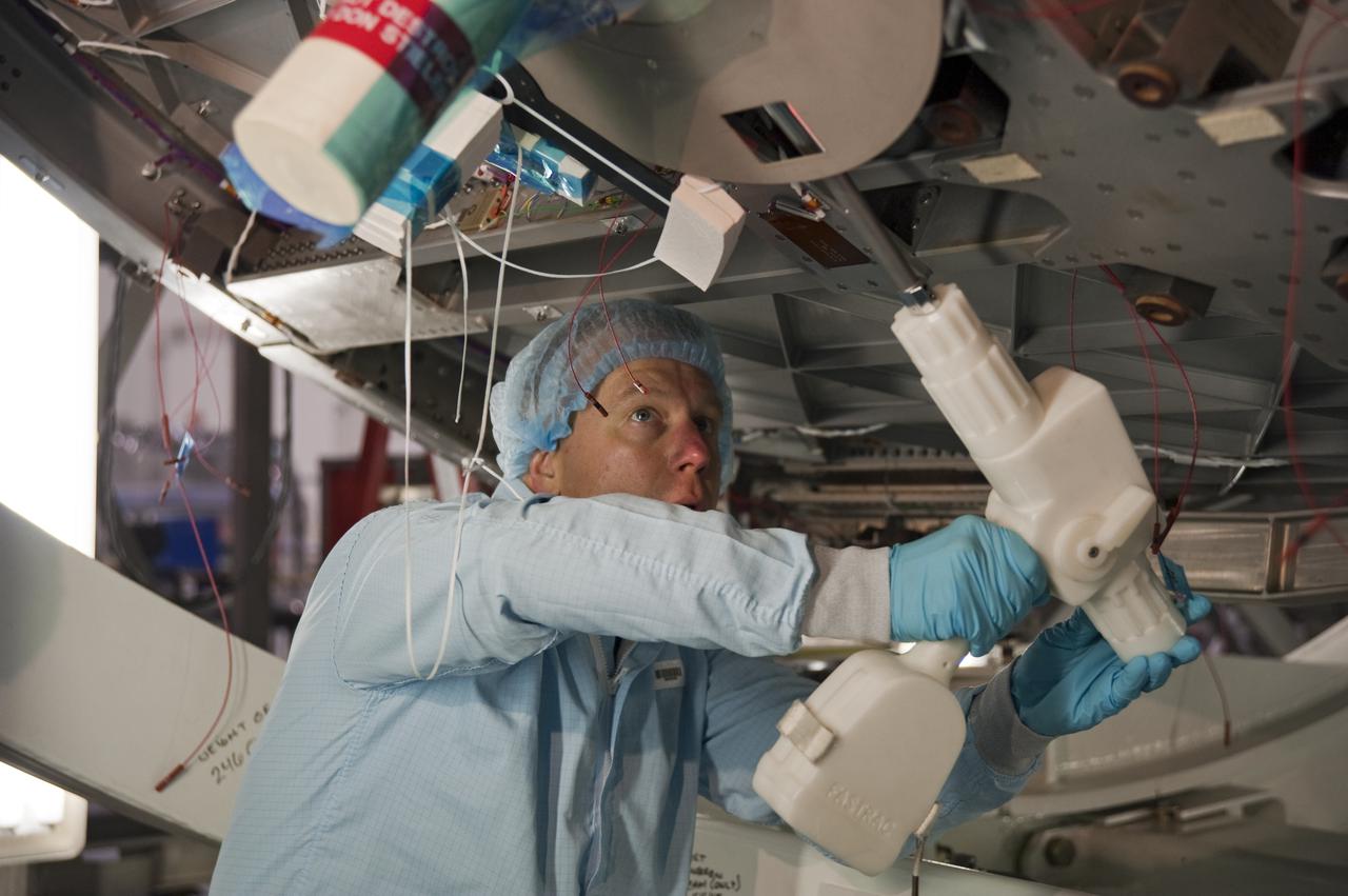 CAPE CANAVERAL, Fla. -- In the Space Station Processing Facility at NASA's Kennedy Space Center in Florida, STS-133 Mission Specialist Tim Kopra practices with a tool he will use while in space.     The astronauts are at Kennedy for the Crew Equipment Interface Test, or CEIT, which provides the crew with hands-on training and observation of shuttle and flight hardware for their mission to the International Space Station. Launch of the STS-133 mission on space shuttle Discovery is targeted for Nov. 1 at 4:33 p.m. EDT. Photo credit: NASA_Kim Shiflett