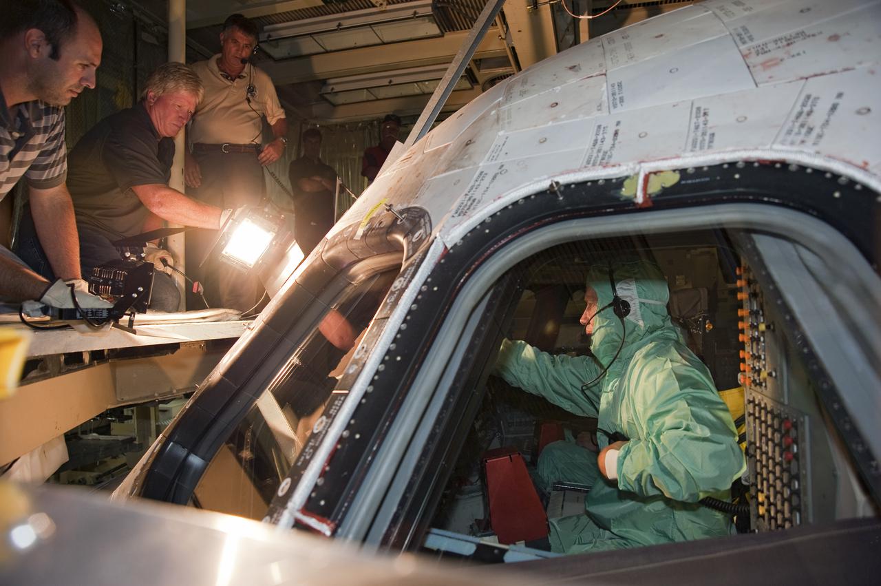 CAPE CANAVERAL, Fla. -- In Orbiter Processing Facility-3 at NASA's Kennedy Space Center in Florida, STS-133 Commander Steve Lindsey familiarizes himself with the layout of the shuttle's cockpit.    The astronauts are at Kennedy for the Crew Equipment Interface Test, or CEIT, which provides the crew with hands-on training and observation of shuttle and flight hardware for their mission to the International Space Station. Launch of the STS-133 mission on space shuttle Discovery is targeted for Nov. 1 at 4:33 p.m. EDT. Photo credit: NASA_Kim Shiflett