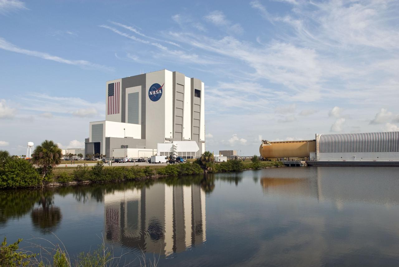 CAPE CANAVERAL, Fla. -- Viewed from across the turn basin in the Launch Complex 39 area at NASA's Kennedy Space Center in Florida, External Tank-138 is being offloaded from the Pegasus barge near the Vehicle Assembly Building. The external fuel tank arrived in Florida on July 13, from NASA's Michoud Assembly Facility near New Orleans. ET-138, the last newly manufactured tank, was originally designated to fly on Endeavour's STS-134 mission to the International Space Station, but later reassigned to fly on space shuttle Atlantis' final mission, STS-135. For information, visit www.nasa.gov_shuttle. Photo credit: NASA_Jim Grossmann