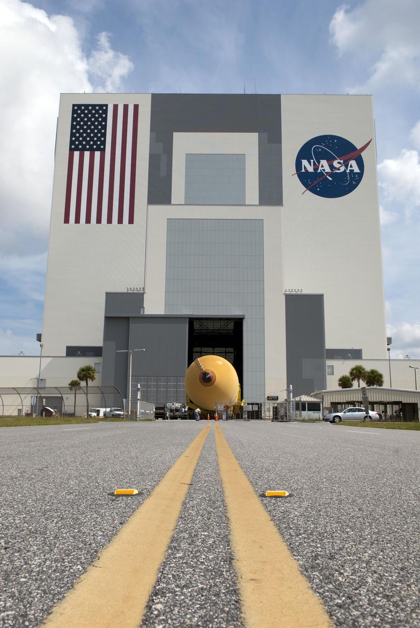 CAPE CANAVERAL, Fla. -- At NASA's Kennedy Space Center in Florida, the massive open door of the Vehicle Assembly Building welcomes External Tank-138. The external fuel tank arrived in Florida on July 13, from NASA's Michoud Assembly Facility near New Orleans. ET-138, the last newly manufactured tank, was originally designated to fly on Endeavour's STS-134 mission to the International Space Station, but later reassigned to fly on space shuttle Atlantis' final mission, STS-135. For information, visit www.nasa.gov_shuttle. Photo credit: NASA_Jim Grossmann