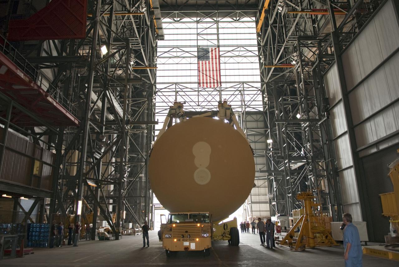 CAPE CANAVERAL, Fla. -- At NASA's Kennedy Space Center in Florida, External Tank-138 is being towed through the massive doors into the transfer aisle of the Vehicle Assembly Building. The external fuel tank arrived in Florida on July 13, from NASA's Michoud Assembly Facility near New Orleans. ET-138, the last newly manufactured tank, was originally designated to fly on Endeavour's STS-134 mission to the International Space Station, but later reassigned to fly on space shuttle Atlantis' final mission, STS-135. For information, visit www.nasa.gov_shuttle. Photo credit: NASA_Jim Grossmann