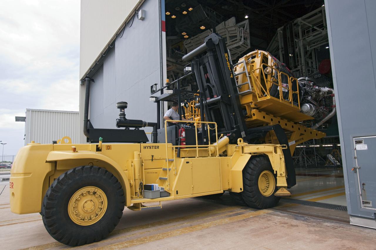 CAPE CANAVERAL, Fla. -- At NASA's Kennedy Space Center in Florida, space shuttle Atlantis' main engine no. 3 is moved out of Orbiter Processing Facility-1 after removal from the shuttle.       Inspection and maintenance of each main engine is standard procedure following a shuttle mission. Some of the engines maintained and stored in the engine shop could be used for Atlantis, on what currently is planned as the 'launch on need,' or potential rescue mission for Endeavour's STS-134 mission, targeted for launch Feb. 26, 2011. For information, visit www.nasa.gov_shuttle. Photo credit: NASA_Jack Pfaller