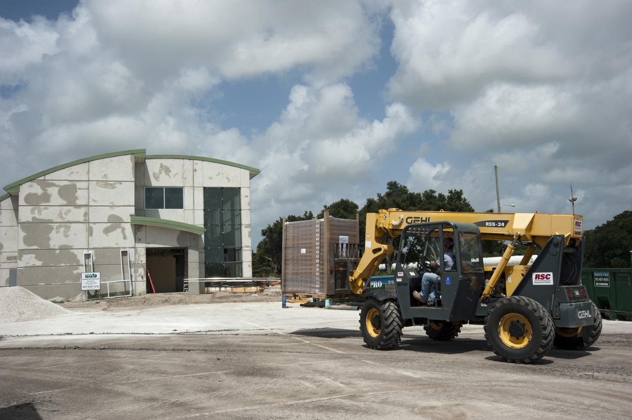 CAPE CANAVERAL, Fla. - At the Propellants North Administrative and Maintenance Facility at NASA's Kennedy Space Center in Florida, the facility's solar panels begin to arrive for installation. The green facility will have a two-story administrative building to house managers, mechanics and technicians who fuel spacecraft at Kennedy adjacent to a single-story shop to store cryogenic fuel transfer equipment.   The facility is striving to qualify for the U.S. Green Building Council’s Leadership in Energy and Environmental Design, or LEED, Platinum certification. If successful, it will be the first NASA facility to achieve this highest of LEED ratings after it is completed in December 2010. The facility was designed for NASA by Jones Edmunds and Associates. H. W. Davis Construction is the construction contractor. Photo credit: NASA_Kim Shiflett