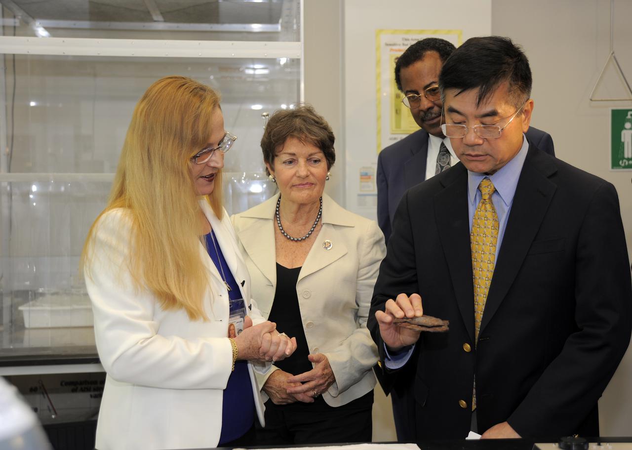 CAPE CANAVERAL, Fla. -- At NASA's Kennedy Space Center in Florida, Luz Marina Calle, left, shows Rep. Suzanne Kosmas, NASA Associate Deputy Administrator Charles Scales and Commerce Secretary Gary Locke the types of experiments taking place in the Space Life Sciences Lab. Calle's research focuses on corrosion prevention. As part of Locke's visit to Kennedy a meeting also was held with about a dozen workers expected to lose their jobs with the retirement of the Space Shuttle Program to discuss what the Commerce Department, NASA and the White House are doing to improve the local economy as the program winds down. NASA Administrator Charlie Bolden and Locke co-chair the White House’s Task Force on Space Industry Workforce and Economic Development, which was formed in May and is expected to provide a report to President Obama this month. Photo credit: NASA_Kim Shiflett