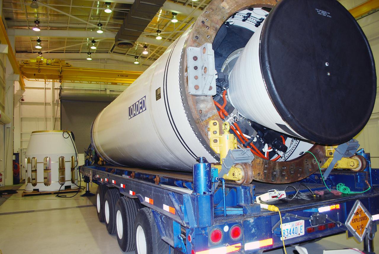VANDENBERG AIR FORCE BASE, Calif. – At Vandenberg Air Force Base in California, the Stage 0 motor, foreground, soon will be installed to the interstage, background. The two segments, along with two other stages, will make up the four-stage Taurus XL rocket that will carry NASA's Glory satellite into low Earth orbit.  Glory is scheduled to launch in November from Vandenberg's Launch Pad SLC 576-E. Once Glory reaches orbit, it will collect data on the properties of aerosols and black carbon. It also will help scientists understand how the sun's irradiance affects Earth's climate.  Photo credit: NASA_Randy Beaudoin, VAFB