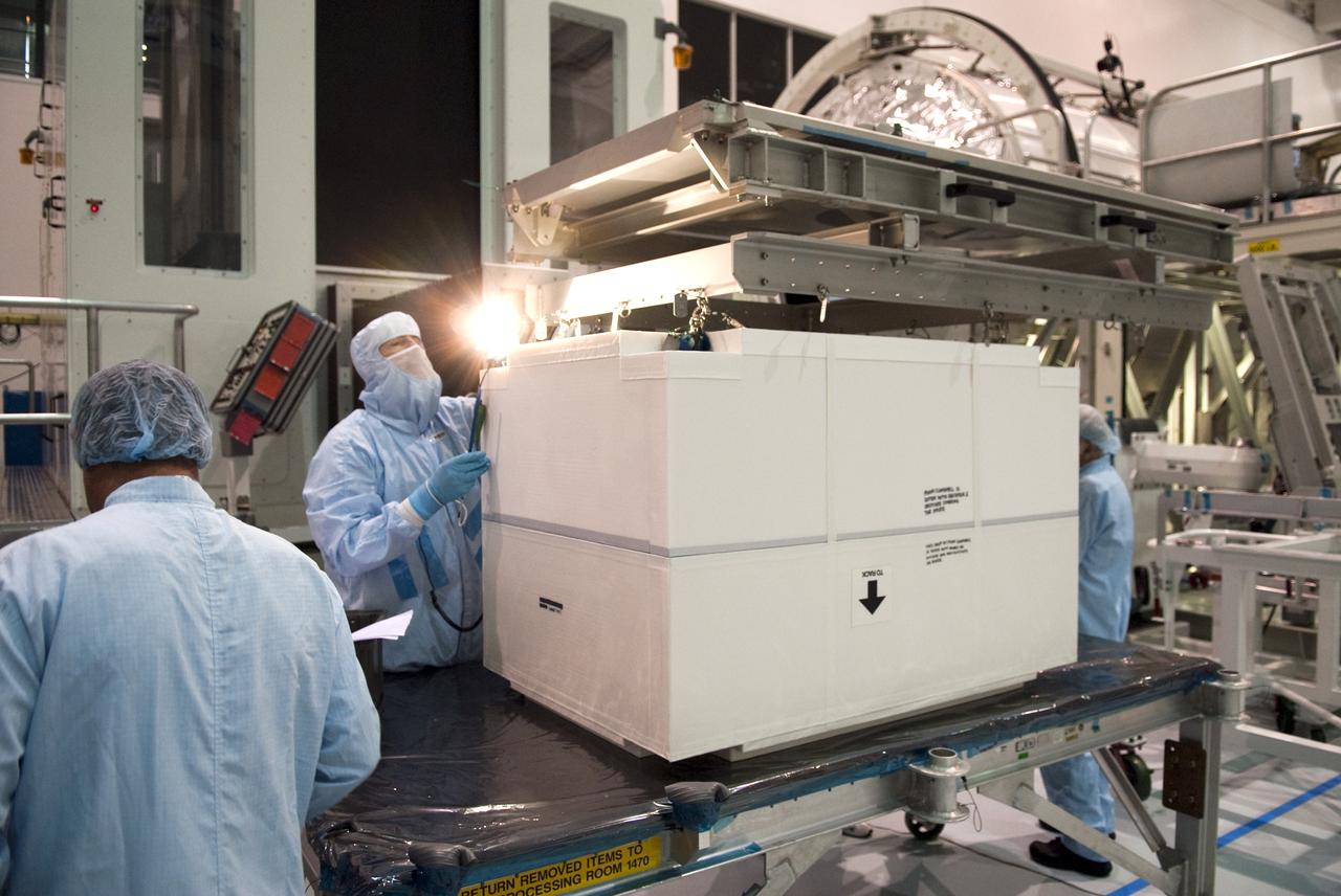 STS-133 R2 ROBONAUT CONTAINER LIFT TO PMM