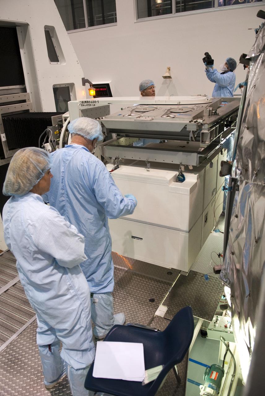 STS-133 R2 ROBONAUT CONTAINER LIFT TO PMM