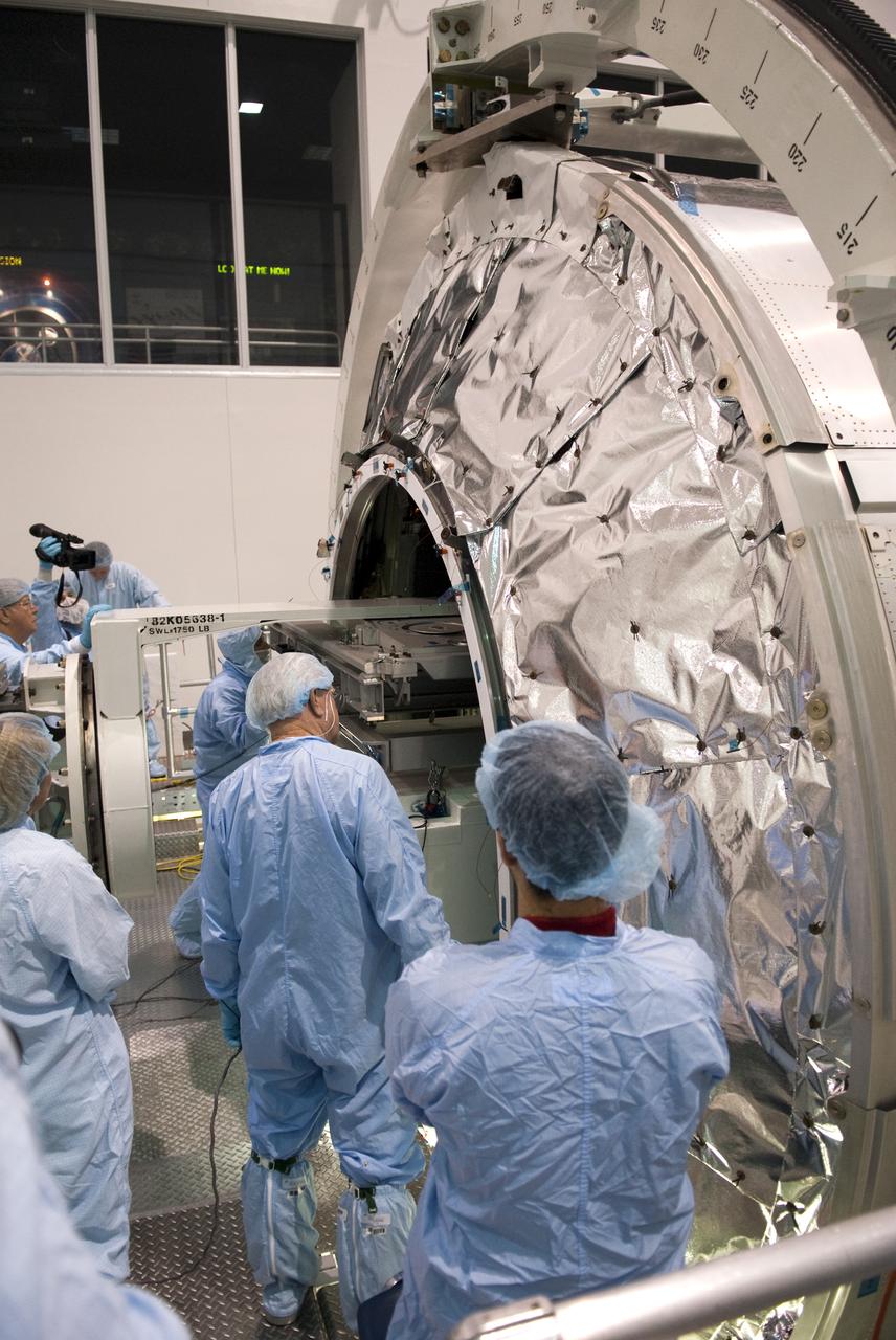 STS-133 R2 ROBONAUT CONTAINER LIFT TO PMM