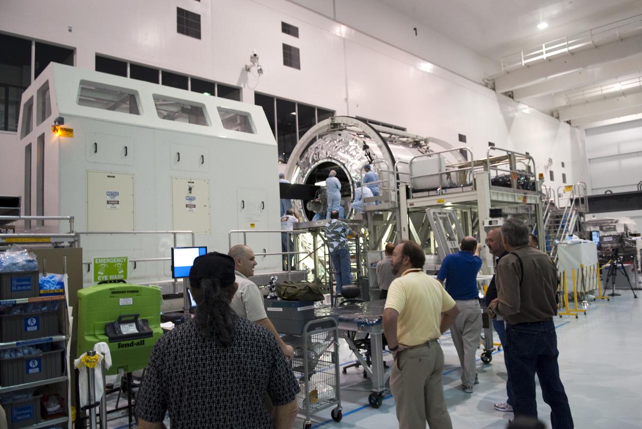 STS-133 R2 ROBONAUT CONTAINER LIFT TO PMM