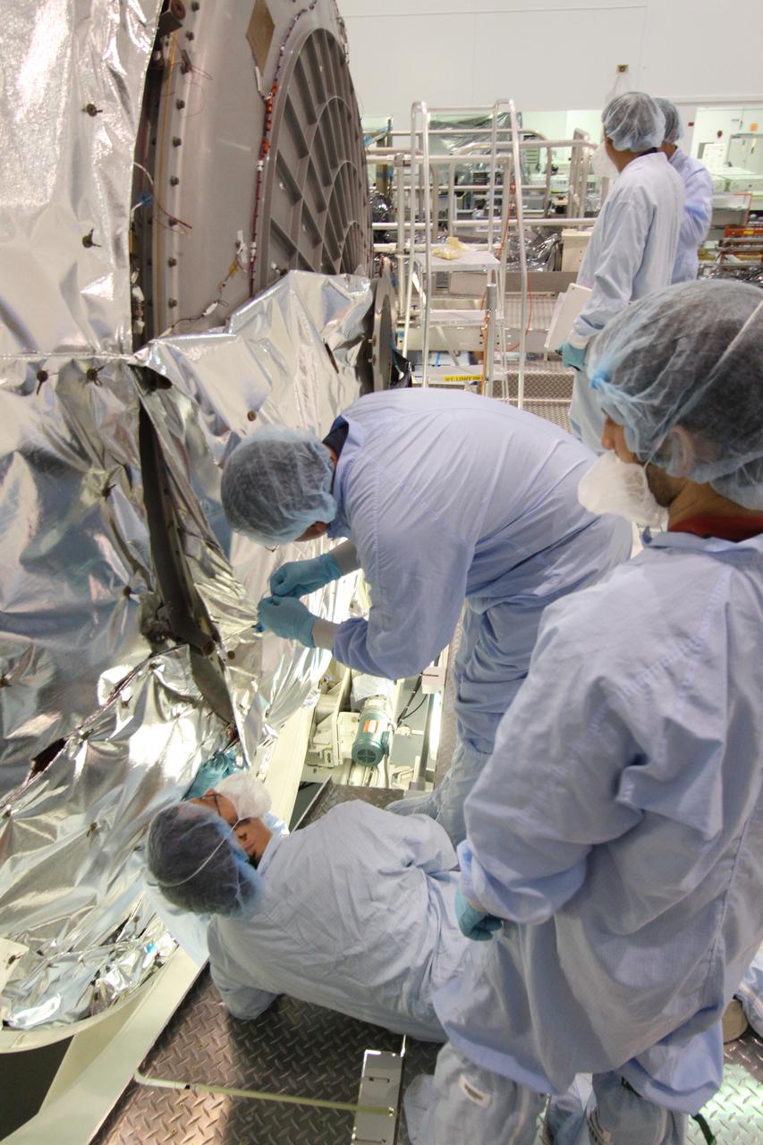 STS-133 PMM Insulation Blankets Installation