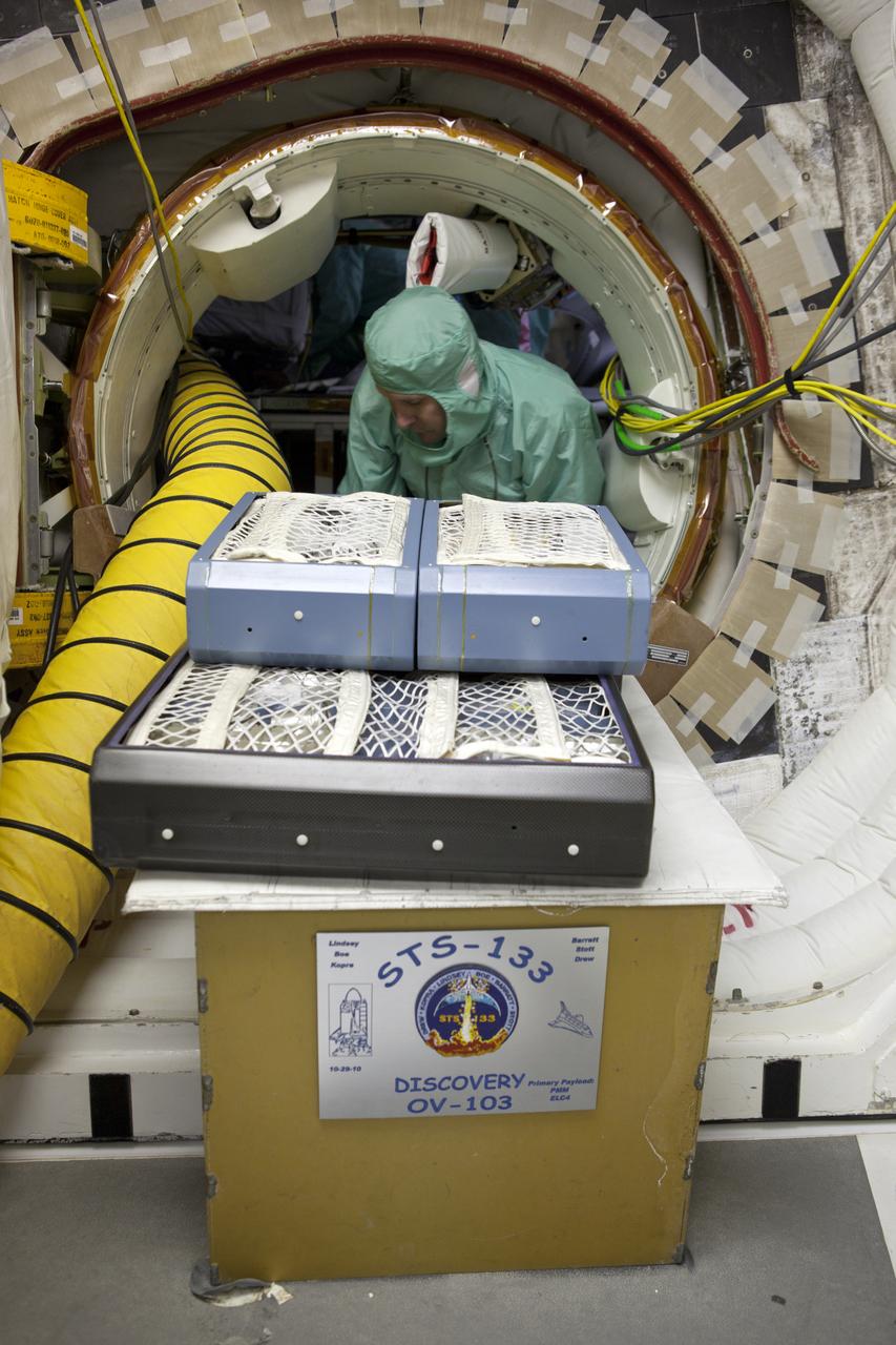 STS-133 DISCOVERY - HARDWARE REMOVAL FROM ORBITER IN WHITE ROOM - ET FOAM REPAIR PREPS WITH TENTS