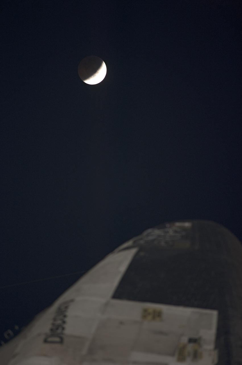 STS-133 Discovery on Pad 39A with Winter Solstice Moon Eclipse - scrubbed Rollback to VAB