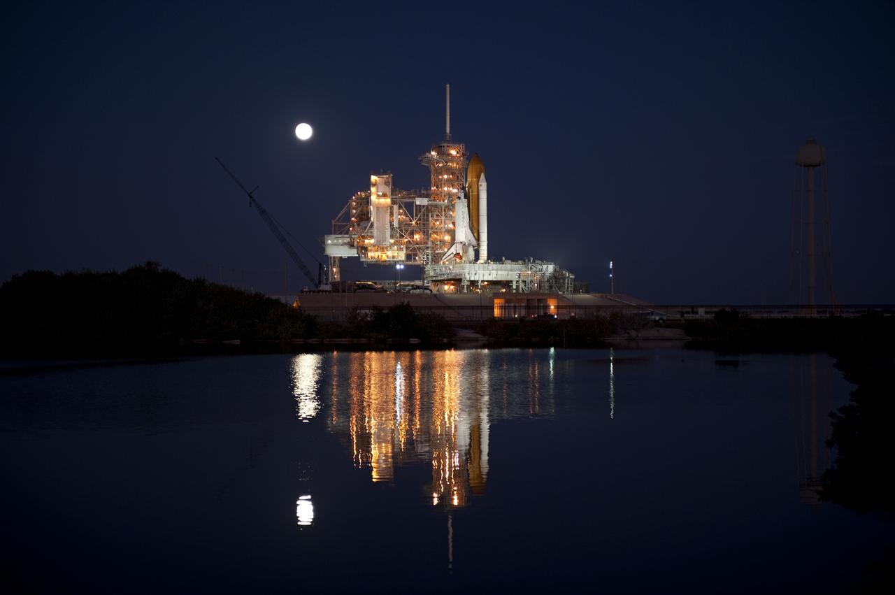 STS-133 Discovery on Pad 39A with Winter Solstice Moon Eclipse - scrubbed Rollback to VAB