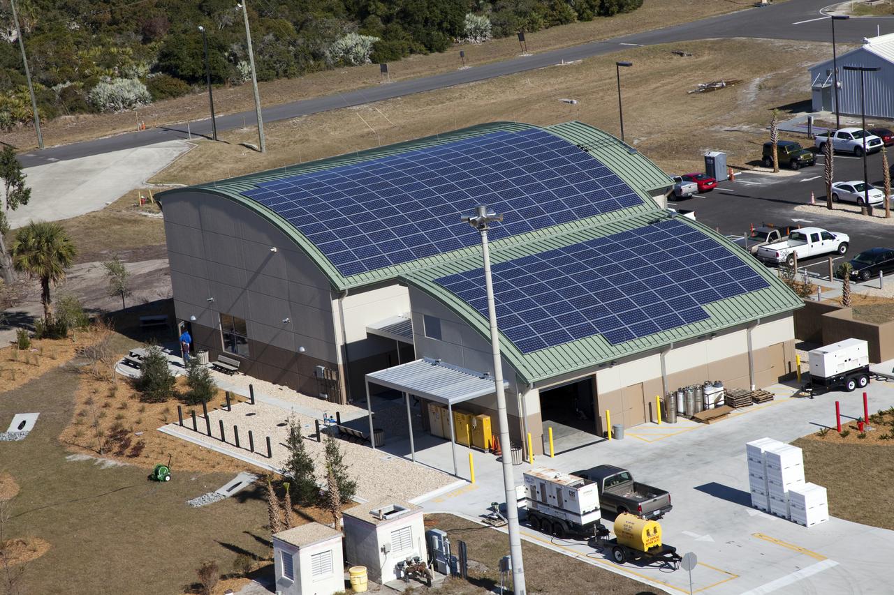 Aerials - STS-133 Discovery on Pad 39A, LEED Bldg., VAB