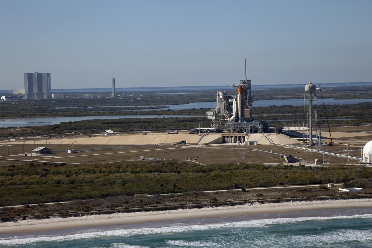 Aerials - STS-133 Discovery on Pad 39A, LEED Bldg., VAB