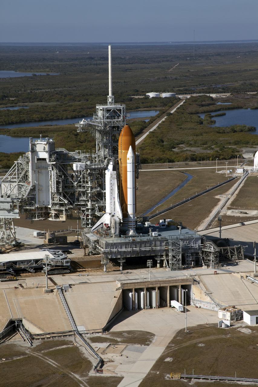 Aerials - STS-133 Discovery on Pad 39A, LEED Bldg., VAB