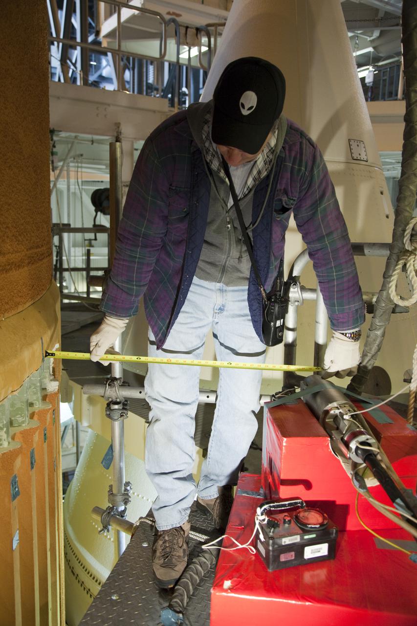 STS-133 Discovery X-ray scans ET-137 in VAB