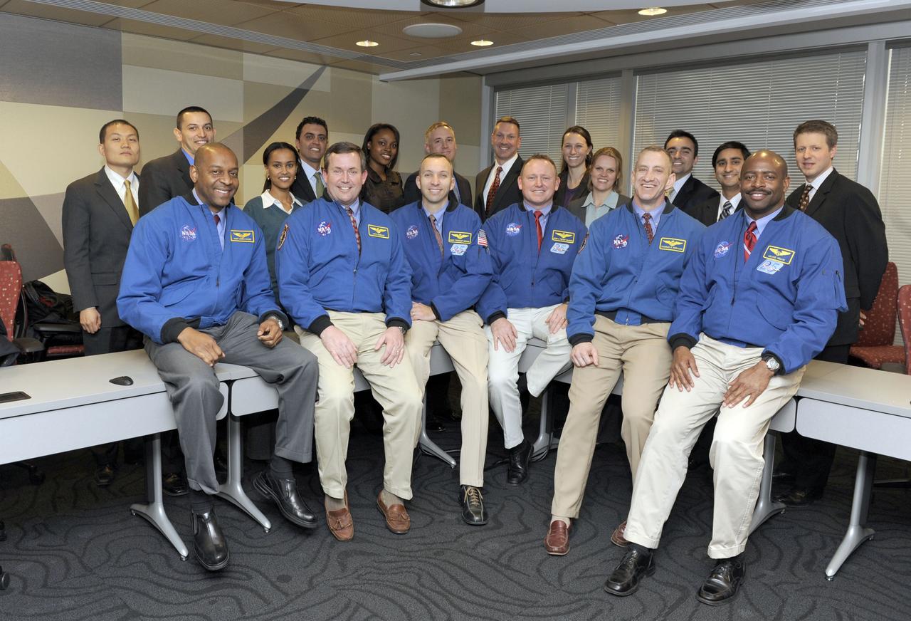 STS-129 crew members from left, Robert Satcher, Mike Foreman, Randy Bresnik, Barry Wilmore, Commander Charles Hobaugh and Leland Melvin pose with a group of White House Fellows at NASA Headquarters in Washington, Monday, Jan. 11, 2010. Photo Credit: (NASA/Paul E. Alers)