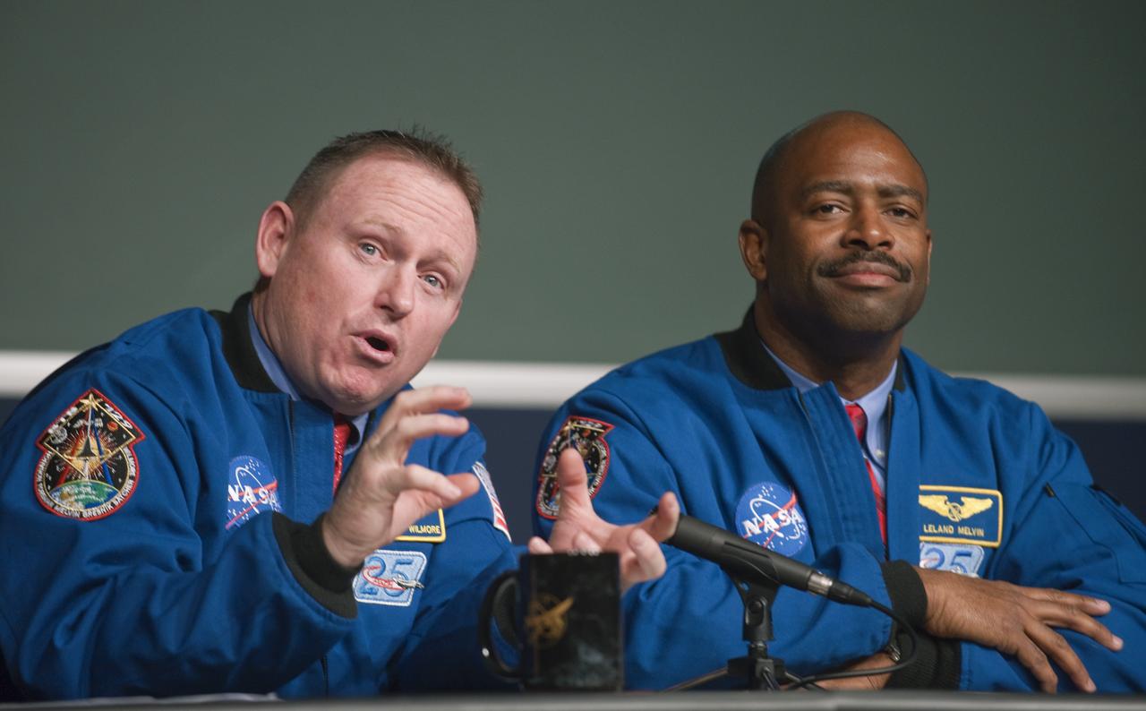 STS-129 Pilot Barry Wilmore, left, answers a question from the audience as Mission Specialist Leland Melvin,  looks on, Monday, Jan. 11, 2010, during a presentation to staff and middle school students from the Congressional Schools of Virginia at NASA Headquarters in Washington. Photo Credit: (NASA/Paul E. Alers)
