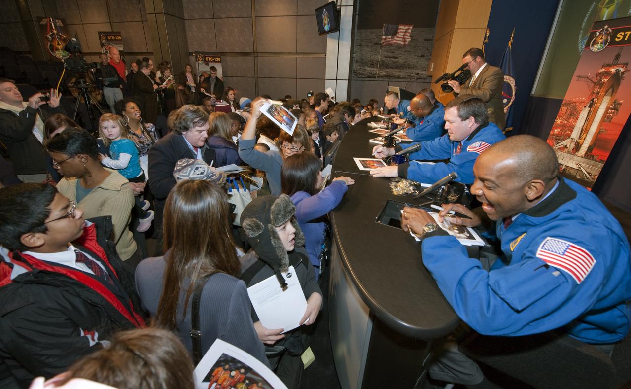 STS-129 Mission Specialist Robert Satcher, lower right, interacts with the audience as he and fellow crew members sign autographs, Monday, Jan. 11, 2010, following a presentation to staff and middle school students from the Congressional Schools of Virginia at NASA Headquarters in Washington. Photo Credit: (NASA/Paul E. Alers)