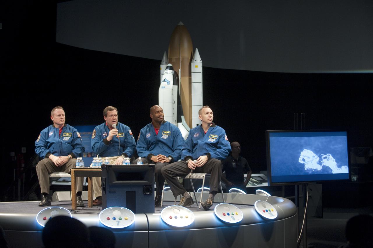 NASA STS-129 mission specialist Mike Foreman, second from left, talks about space walking as crew members Barry Wilmore, left, Leland Melvin and Randy Bresnick, right, look on during a presentation about their recent mission, Thursday, Jan. 14, 2010, at the Smithsonian National Air and Space Museum in Washington. Photo Credit: (NASA/Paul E. Alers)