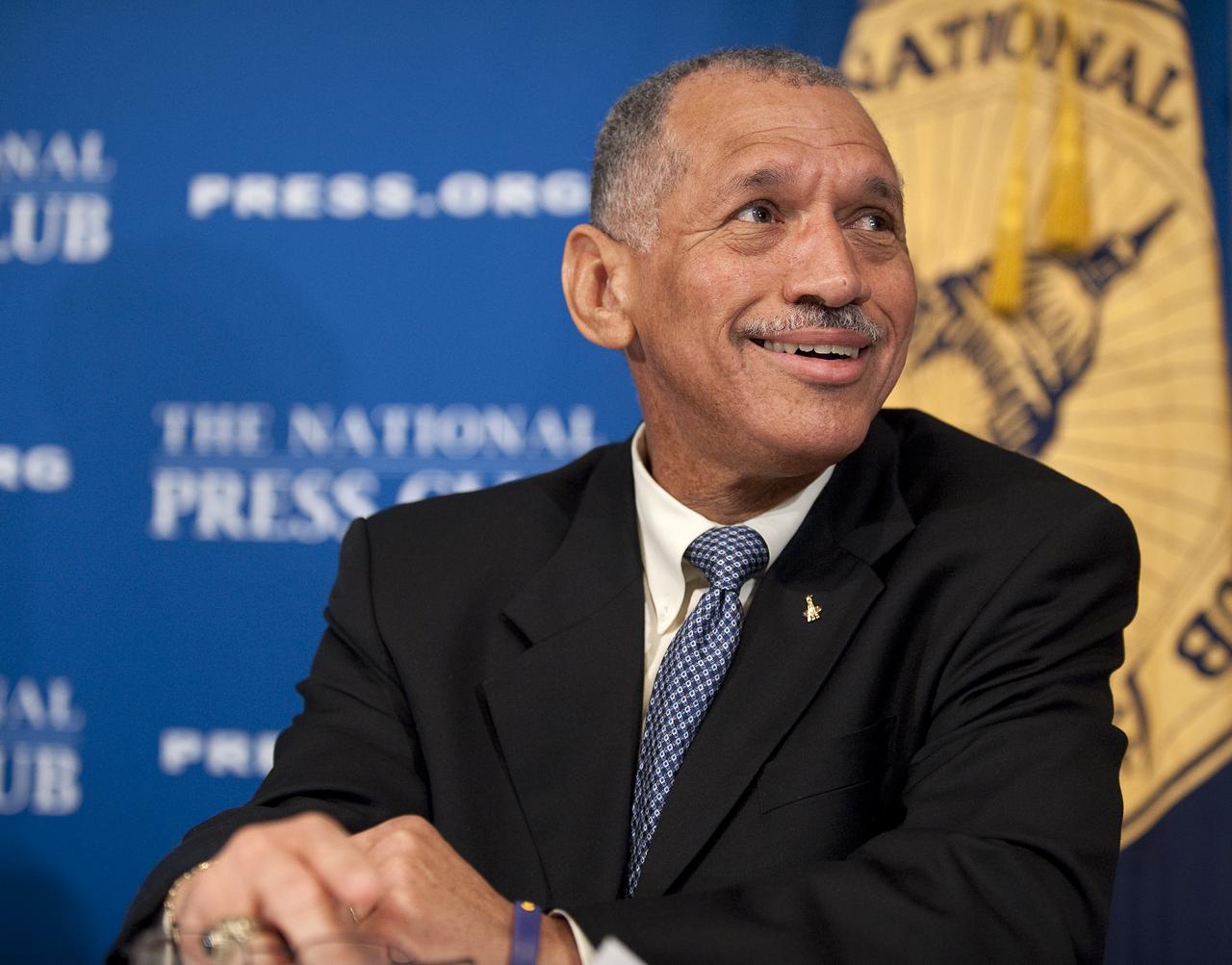 NASA Administrator Charles Bolden listens to his introduction by Assistant to the President for Science and Technology and Director of the White House Office of Science and Technology Policy Dr. John P. Holdren during a press conference, Tuesday, Feb. 2, 2010, at the National Press Club in Washington, where it was announced that NASA has awarded $50 million through funded agreements to further the commercial sector's capability to support transport of crew to and from low Earth orbit. Photo Credit: (NASA/Bill Ingalls)