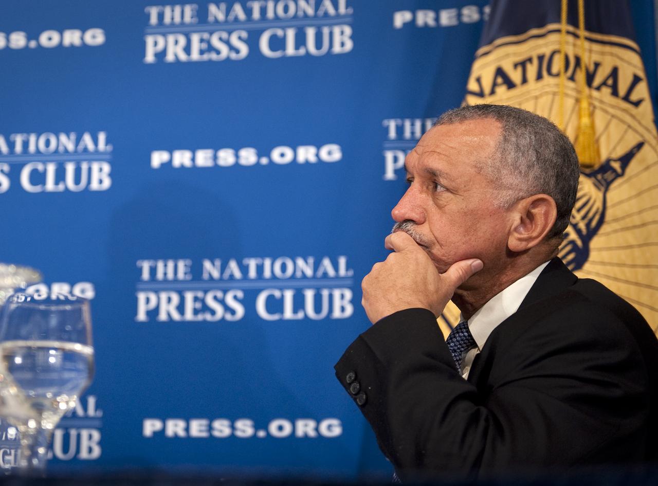 NASA Administrator Charles Bolden listens to his introduction by Assistant to the President for Science and Technology and Director of the White House Office of Science and Technology Policy Dr. John P. Holdren during a press conference, Tuesday, Feb. 2, 2010, at the National Press Club in Washington, where it was announced that NASA has awarded $50 million through funded agreements to further the commercial sector's capability to support transport of crew to and from low Earth orbit. Photo Credit: (NASA/Bill Ingalls)