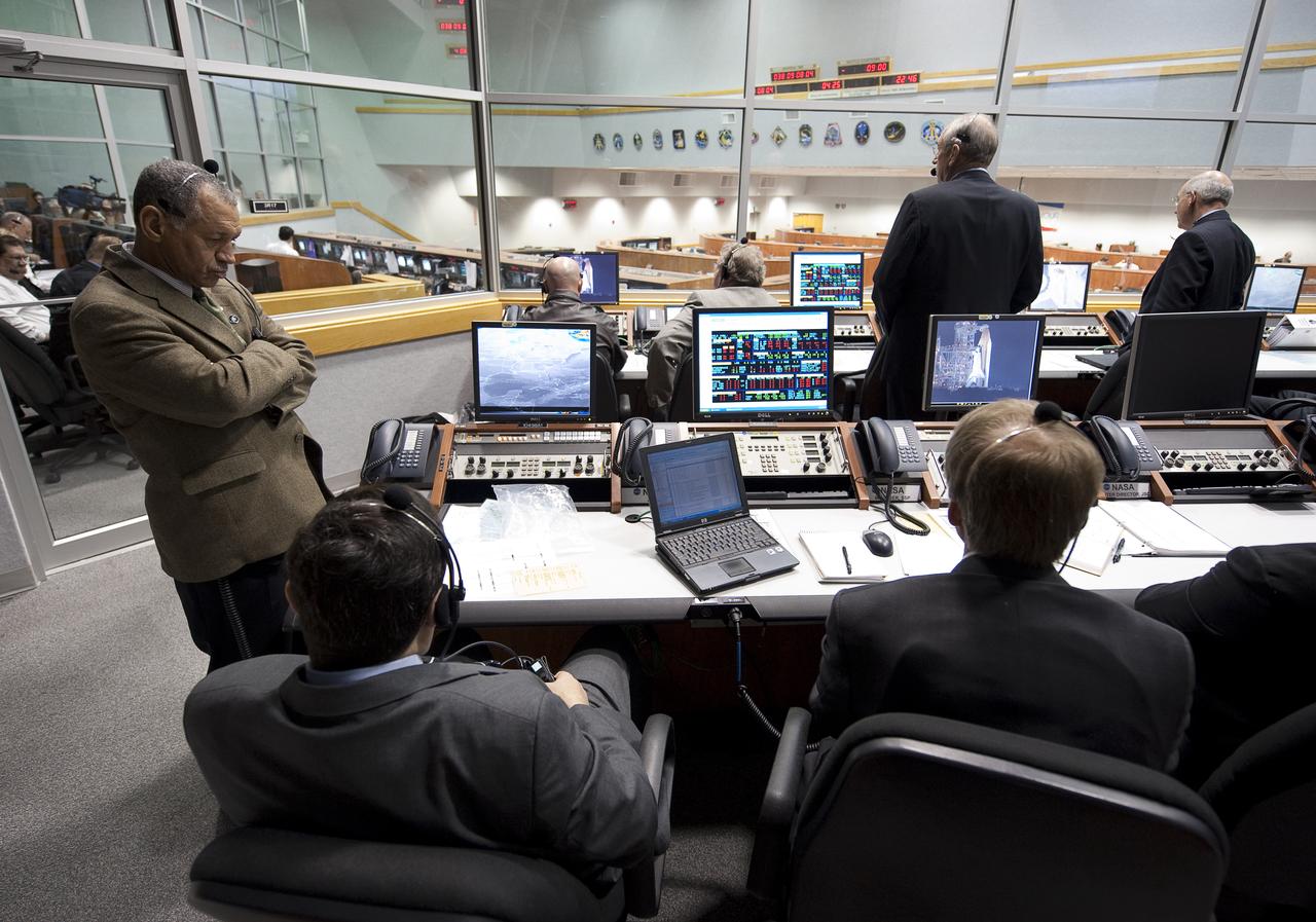 NASA Administrator Charles Bolden, standing left, and other NASA mission managers monitor the countdown of the launch of the space shuttle Endeavour and the start of the STS-130 mission from Firing Room Four of the Launch Control Center at NASA Kennedy Space Center in Cape Canaveral, Fla. on Sunday Feb. 7, 2010.  Space shuttle Endeavour's launch attempt was scrubbed due to a low cloud ceiling over Kennedy Space Center. Photo Credit: (NASA/Bill Ingalls)