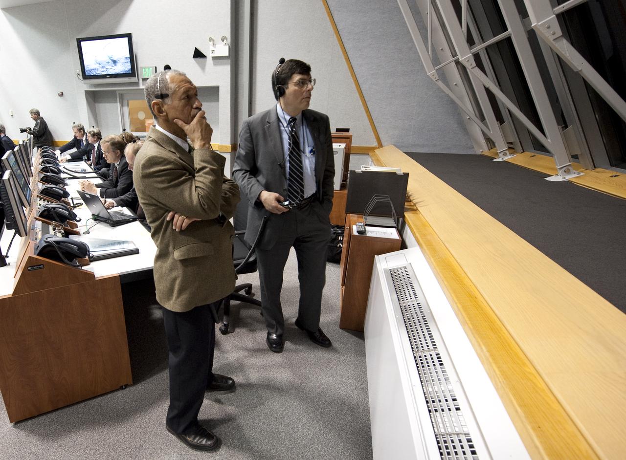 NASA Administrator Charles Bolden, left, and Associate Administrator Chris Scolese look out the window of Firing Room Four of the Launch Control Center as they monitor the countdown of the launch of the space shuttle Endeavour and the start of the STS-130 mission at NASA Kennedy Space Center in Cape Canaveral, Fla. on Sunday Feb. 7, 2010.  Space shuttle Endeavour's launch attempt was scrubbed due to a low cloud ceiling over Kennedy Space Center. Photo Credit: (NASA/Bill Ingalls)