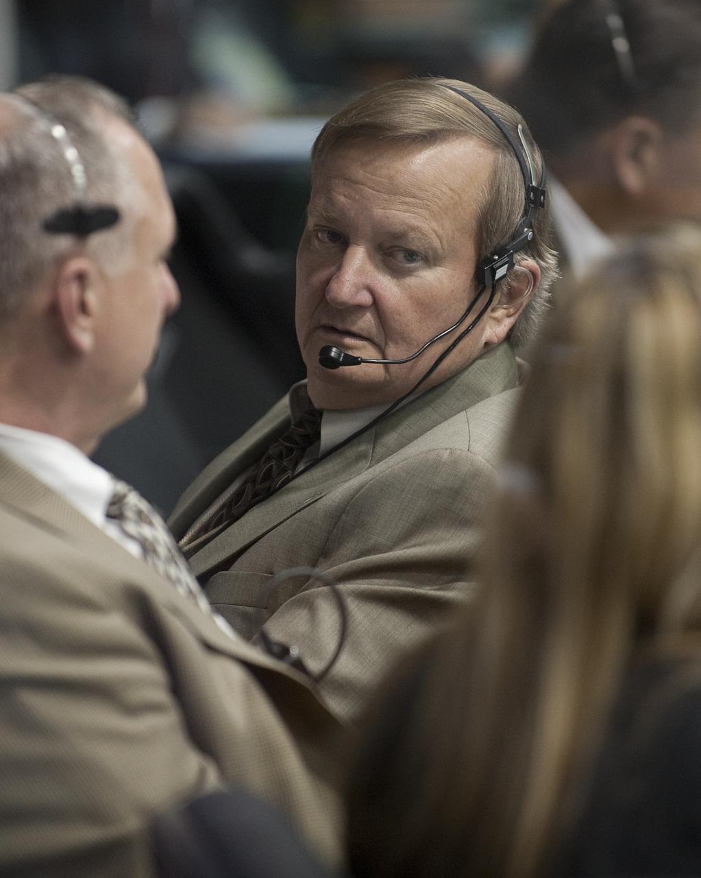 NASA Shuttle Launch Director Michael Leinbach talks with other launch managers in Firing Room Four of the Launch Control Center as they monitor the countdown of the launch of the space shuttle Endeavour and the start of the STS-130 mission at NASA Kennedy Space Center in Cape Canaveral, Fla. on Monday Feb. 8, 2010.  Photo Credit: (NASA/Bill Ingalls)