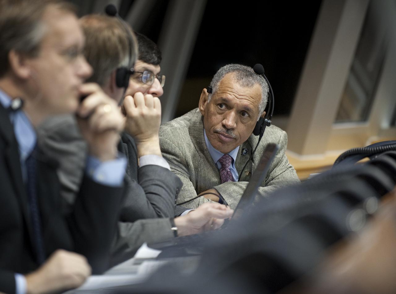 NASA Administrator Charles Bolden talks with other NASA mission managers in Firing Room Four of the Launch Control Center as they monitor the countdown of the launch of the space shuttle Endeavour and the start of the STS-130 mission at NASA Kennedy Space Center in Cape Canaveral, Fla. on Monday Feb. 8, 2010.  Photo Credit: (NASA/Bill Ingalls)