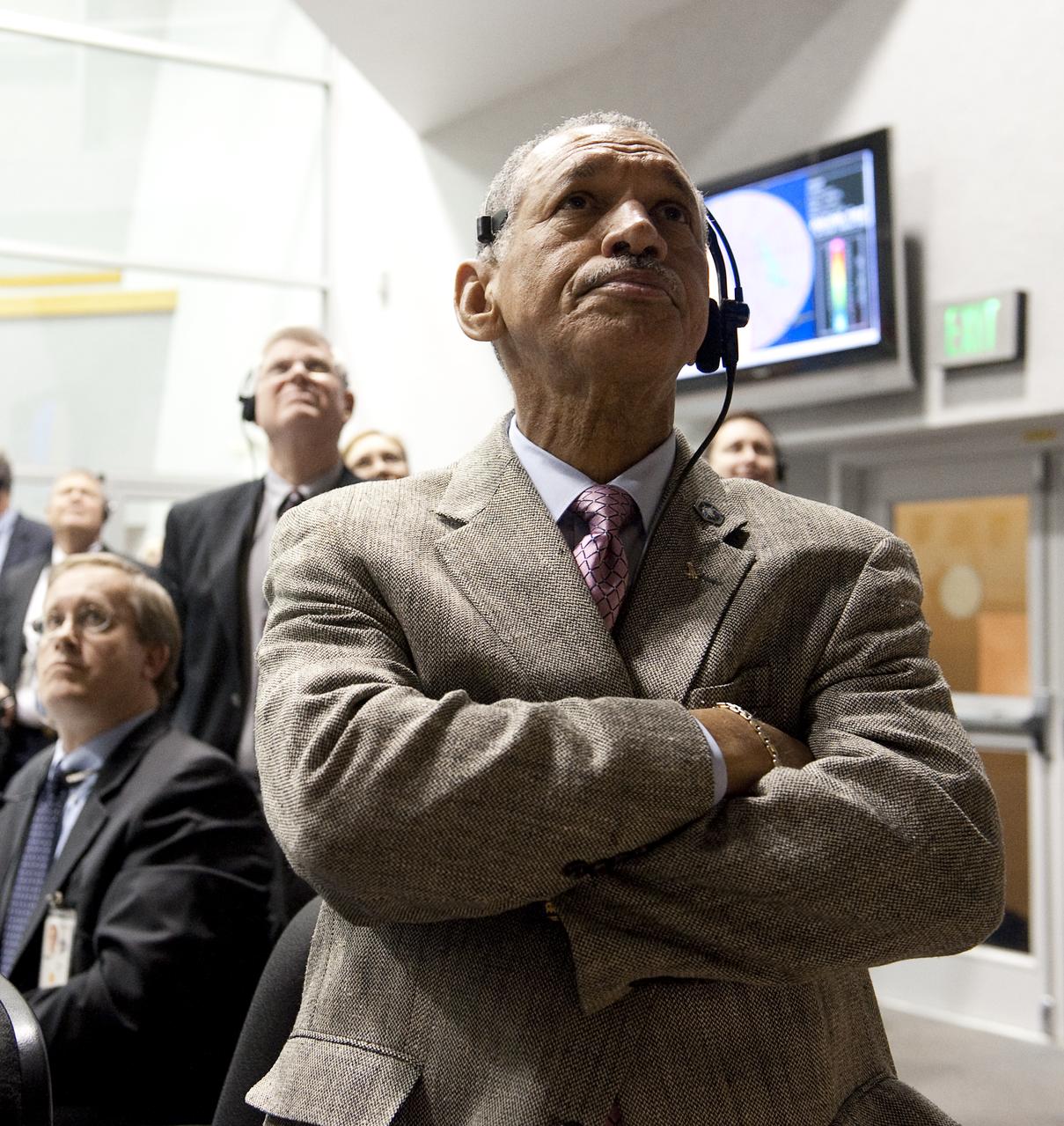 NASA Administrator Charles Bolden looks out the window of Firing Room Four in the Launch Control Center during the launch of the space shuttle Endeavour and the start of the STS-130 mission at NASA Kennedy Space Center in Cape Canaveral, Fla. on Monday Feb. 8, 2010. Endeavour and its crew will deliver to the International Space Station a third connecting module, the Italian-built Tranquility node and the seven-windowed cupola, which will be used as a control room for robotics. The mission will feature three spacewalks. Photo Credit: (NASA/Bill Ingalls)