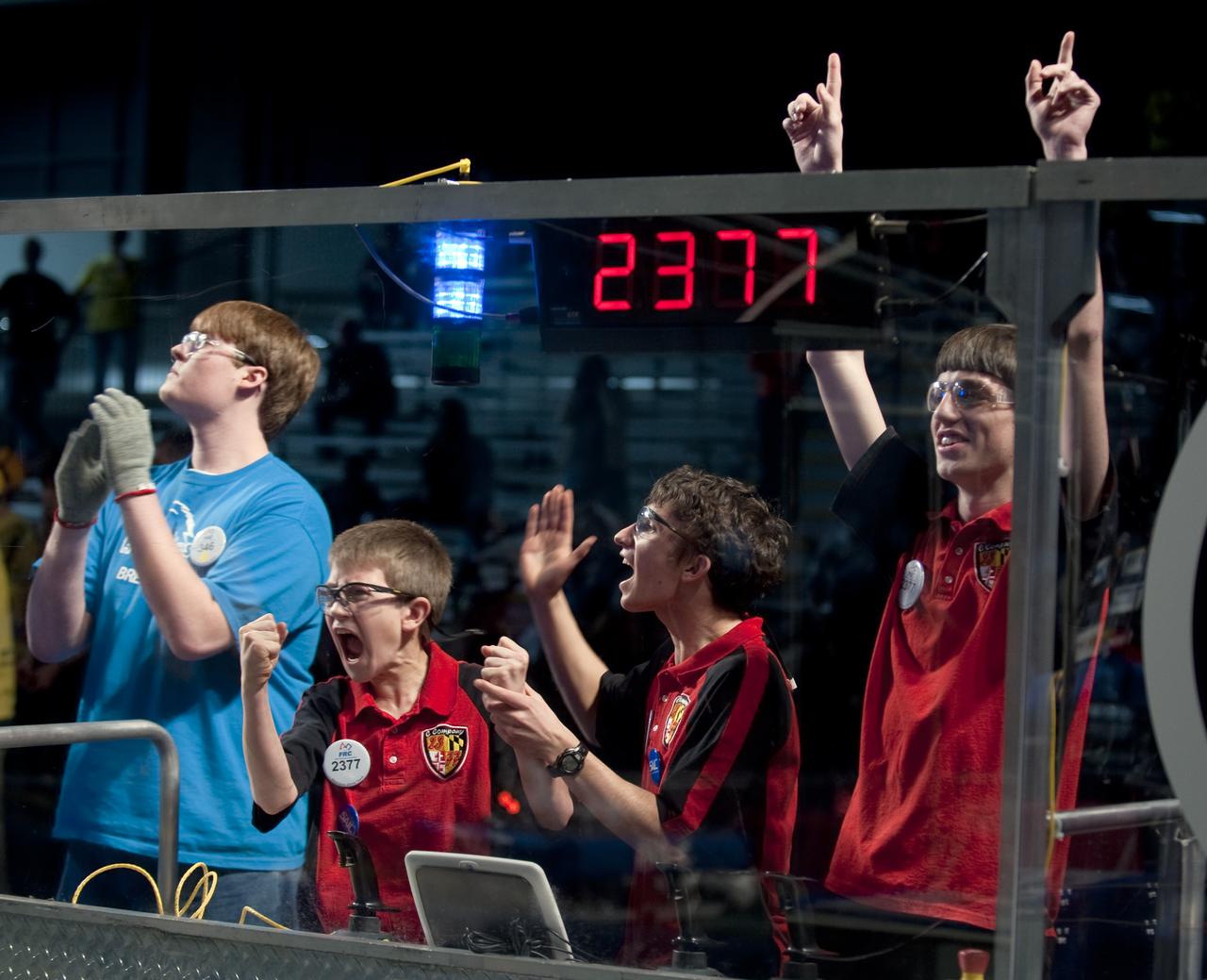 Members of team 2377, in red, from Chesapeake High School in Maryland, react following a match during the second day of competition at the First Robotics Competition, Saturday, March 6, 2010, in Washington. The student competition is called "For Inspiration and Recognition of Science and Technology", or FIRST. The program was founded in 1989 by Dean Kamen to inspire an appreciation of science and technology in young people, their schools and communities. Photo Credit: (NASA/Paul E. Alers)