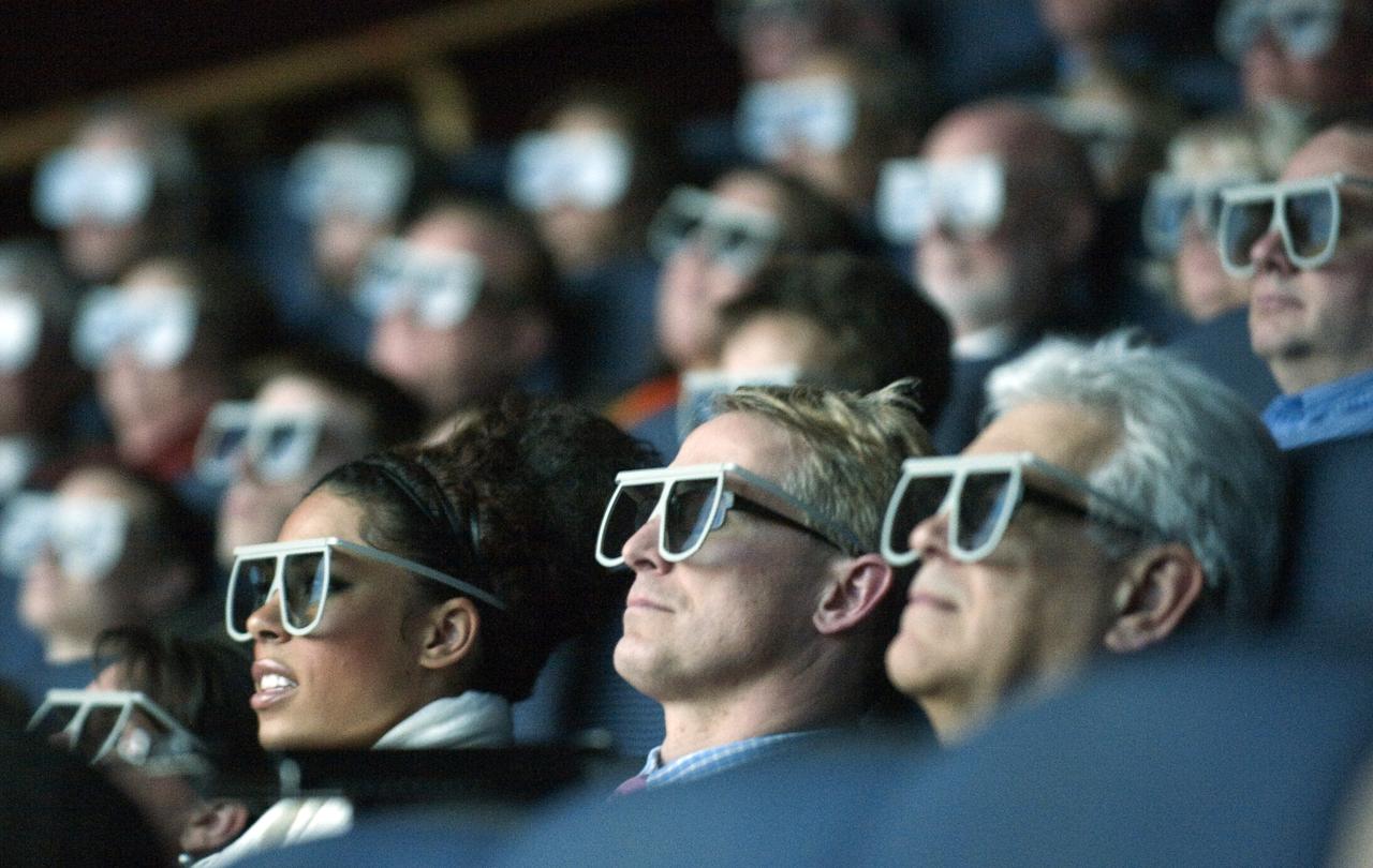 Moviegoers wear 3D glasses as they watch the World Premiere of "Hubble 3D", screened at the Smithsonian's Air and Space Museum Tuesday evening, March 9, 2010, in Washington. Photo Credit: (NASA/Paul E. Alers)