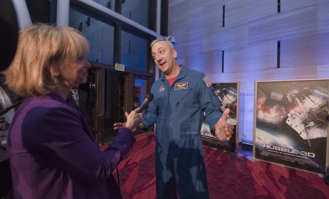 STS-125 astronaut Mike Massimino, speaks to a reporter on the red carpet prior to the World Premiere of "Hubble 3D", screened at the Smithsonian's Air and Space Museum Tuesday evening, March 9, 2010, in Washington. Photo Credit: (NASA/Paul E. Alers)