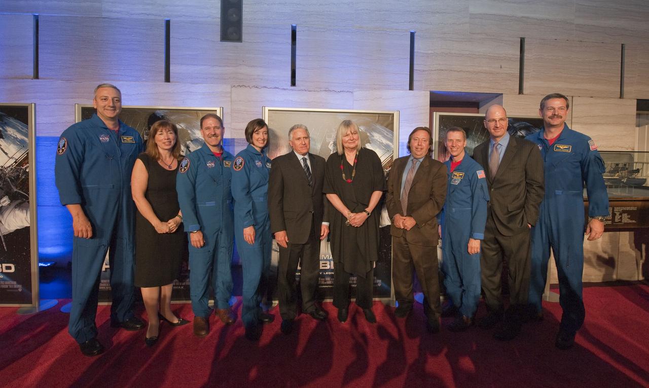 Lori Garver, NASA Deputy Administrator, second from left, stands with members of the STS-125 crew and IMAX officials including Producer/Director Toni Myers, fifth from right, prior to the World Premiere of "Hubble 3D", screened at the Smithsonian's Air and Space Museum Tuesday evening, March 9, 2010, in Washington. Members of the STS-125 crew, dressed in their blue flight suits from left are; Mike Massimino, John Grunsfeld, Megan McArthur, Greg Johnson and Scott Altman. Photo Credit: (NASA/Paul E. Alers)