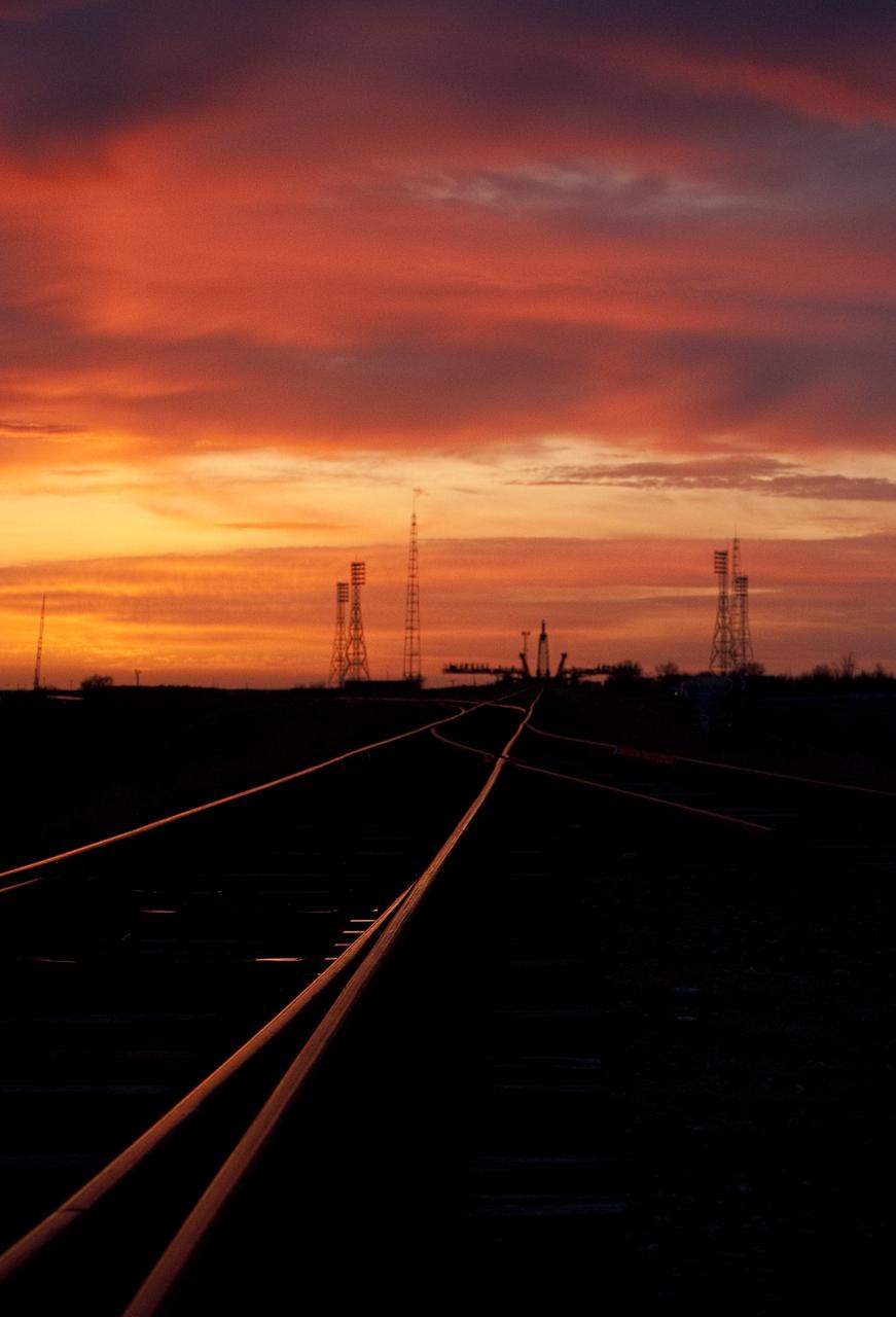 The sun rises behind the Soyuz launch pad shortly before the Soyuz TMA-18 spacecraft is rolled out by the train to the launch pad at the Baikonur Cosmodrome, Kazakhstan, Wednesday, March, 321, 2010.  The launch of the Soyuz spacecraft with Expedition 23 Soyuz Commander Alexander Skvortsov of Russia, Flight Engineer Mikhail Kornienko of Russia and NASA Flight Engineer Tracy Caldwell Dyson is scheduled for Friday, April 2, 2010 at 10:04 a.m. Kazakhstan time.  Photo Credit: (NASA/Carla Cioffi) 