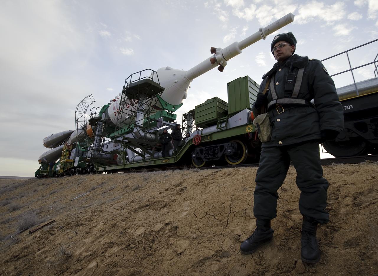 A Russian security officer stands guard as the Soyuz TMA-18 spacecraft is rolled out by train to the launch pad at the Baikonur Cosmodrome, Kazakhstan, Wednesday, March, 31, 2010. The launch of the Soyuz spacecraft with Expedition 23 Soyuz Commander Alexander Skvortsov of Russia, Flight Engineer Mikhail Kornienko of Russia, and NASA Flight Engineer Tracy Caldwell Dyson is scheduled for Friday, April 2, 2010 at 10:04 a.m. Kazakhstan time. Photo Credit (NASA/Bill Ingalls)