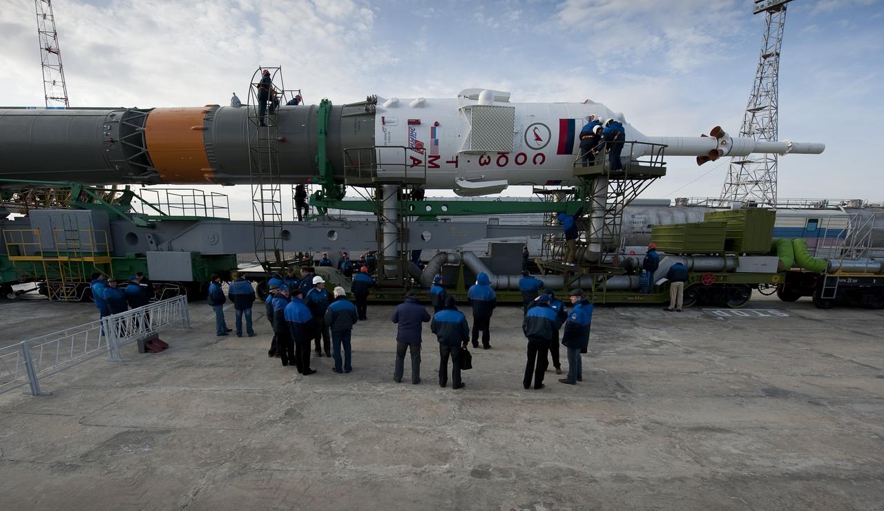 Pad technicians prepare to raise the Soyuz TMA-18 spacecraft shortly after it was rolled out by train to the launch pad at the Baikonur Cosmodrome, Kazakhstan, Wednesday, March, 31, 2010. The launch of the Soyuz spacecraft with Expedition 23 Soyuz Commander Alexander Skvortsov of Russia, Flight Engineer Mikhail Kornienko of Russia, and NASA Flight Engineer Tracy Caldwell Dyson is scheduled for Friday, April 2, 2010 at 10:04 a.m. Kazakhstan time. Photo Credit (NASA/Bill Ingalls)