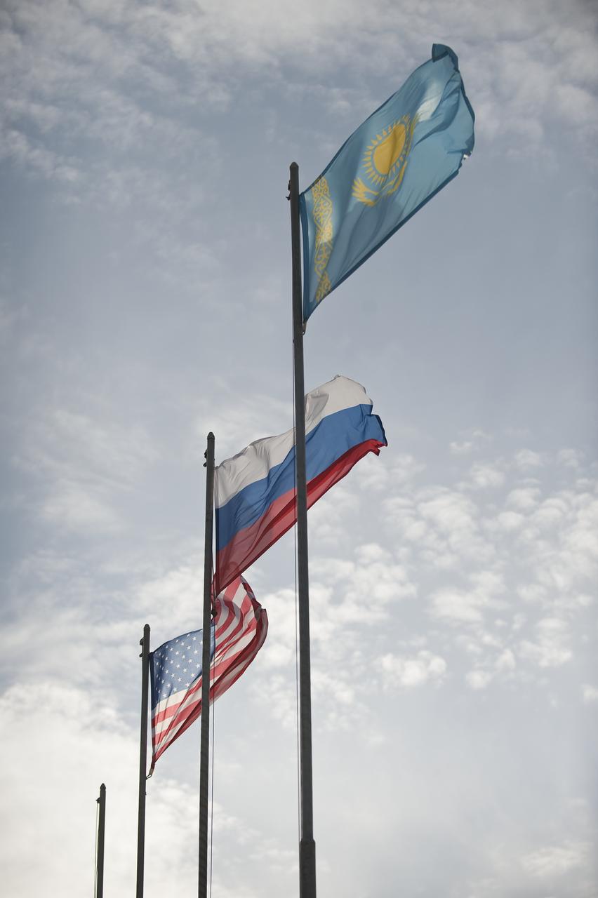 The flags of the United States, Russia and Kazakhstan are seen at the launch pad after the Soyuz TMA-18 spacecraft was rolled out by train to the launch pad at the Baikonur Cosmodrome, Kazakhstan, Wednesday, March, 31, 2010. The launch of the Soyuz spacecraft with Expedition 23 Soyuz Commander Alexander Skvortsov of Russia, Flight Engineer Mikhail Kornienko of Russia, and NASA Flight Engineer Tracy Caldwell Dyson is scheduled for Friday, April 2, 2010 at 10:04 a.m. Kazakhstan time. Photo Credit (NASA/Bill Ingalls)